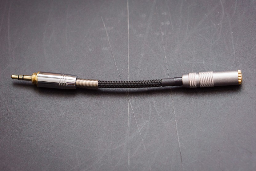 Custom-made headphone adapter cable with attenuation